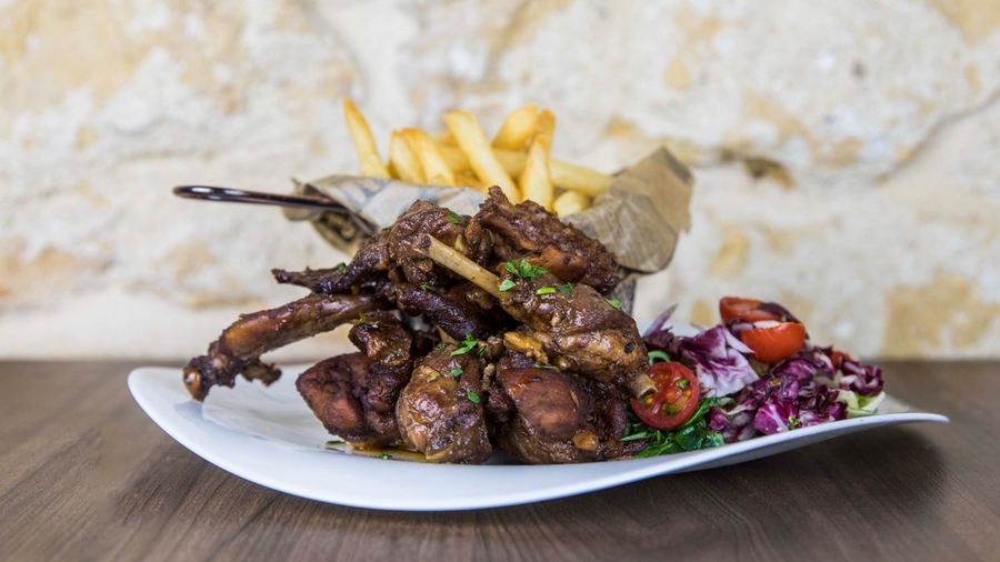 Fried local rabbit in garlic and white wine, a Maltese classic served at 1939 Bistro